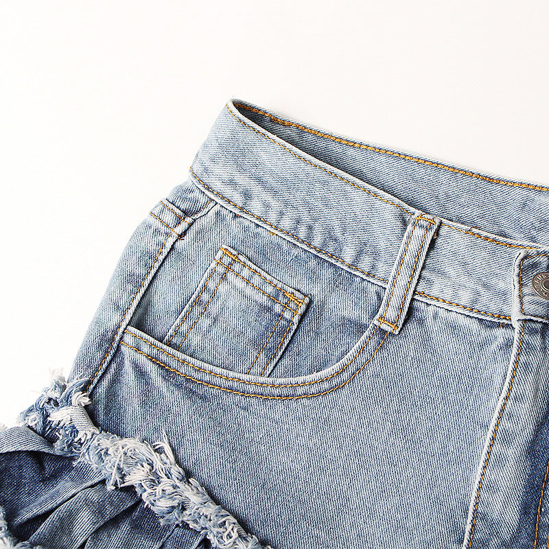 Jeansshorts med fransad volangkant