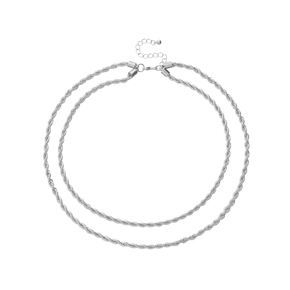 Lagerhalsband i guldfärg med mynt och berlocker