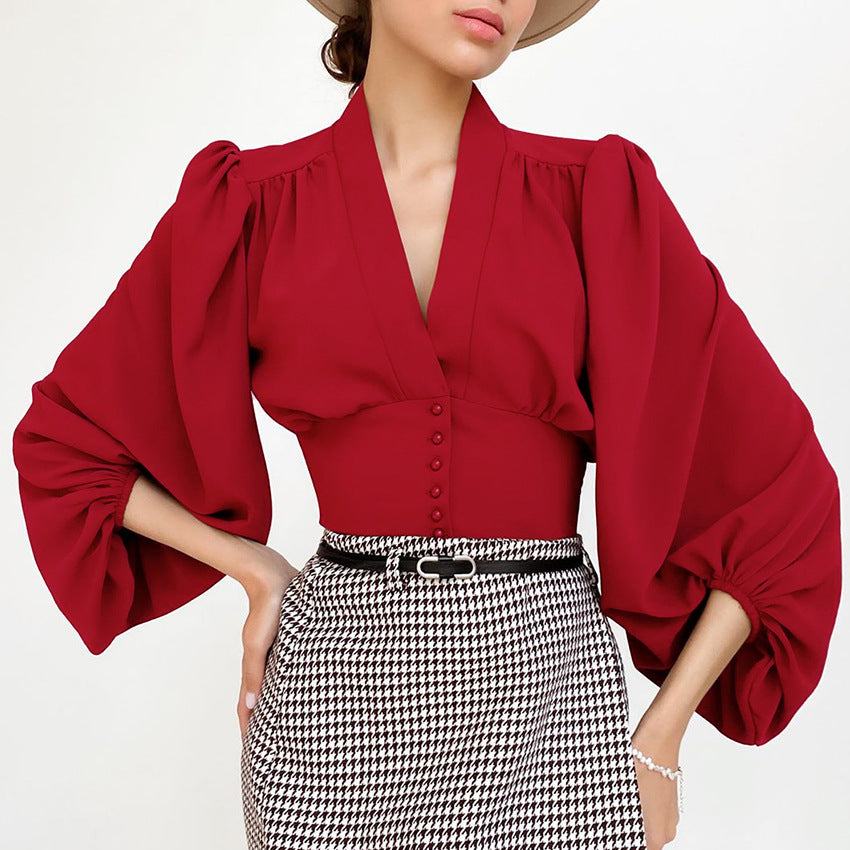 Elegant blus med V-ringning och lyktärm