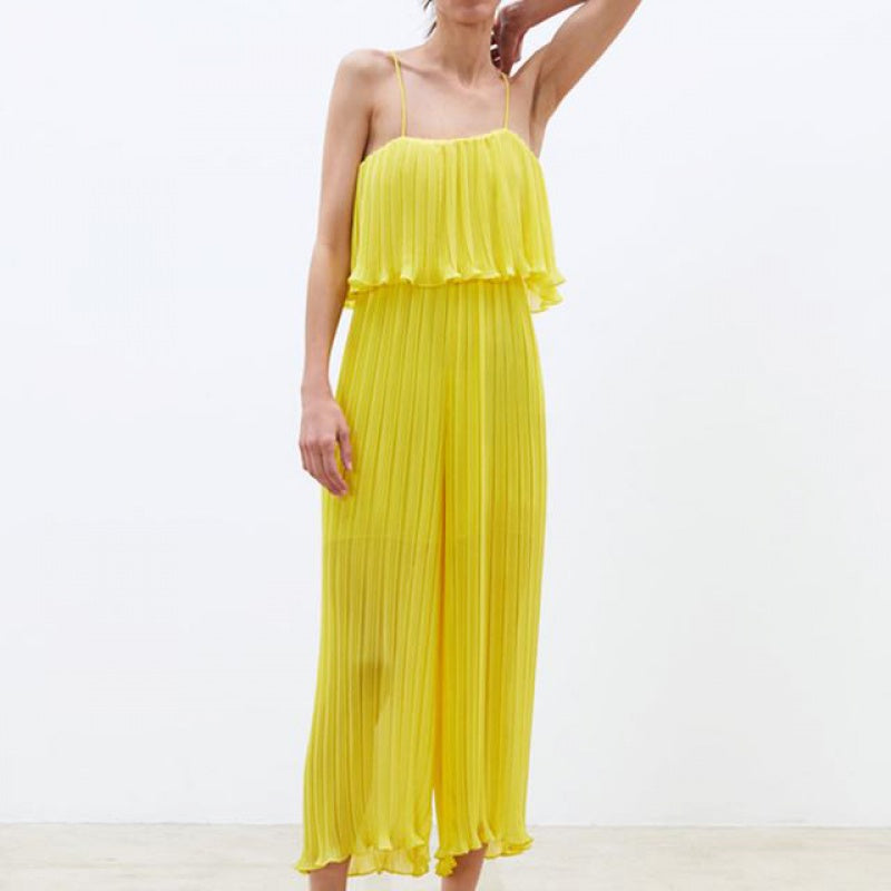 Plisserad jumpsuit med volang och vida ben