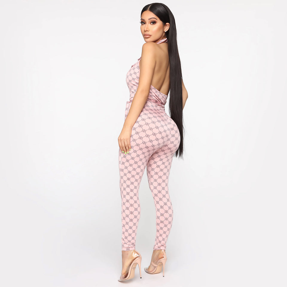 Mönstrad halterneck-jumpsuit med djup v-ringning