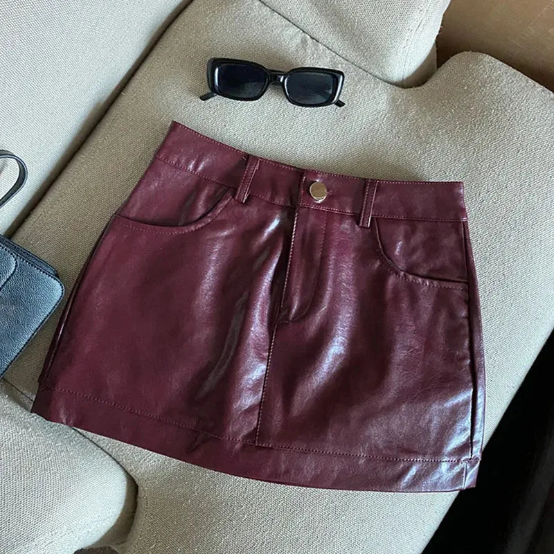 Minikjol i skinnimitation med hög midja