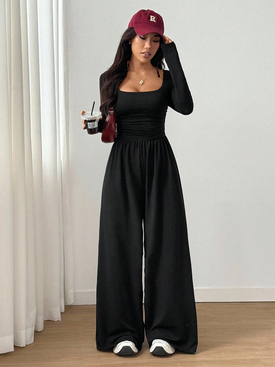 Jumpsuit med fyrkantig ringning och vida ben