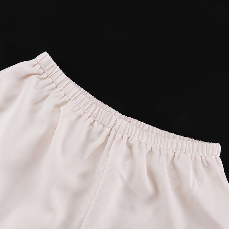 Set med linne med rosetter och shorts